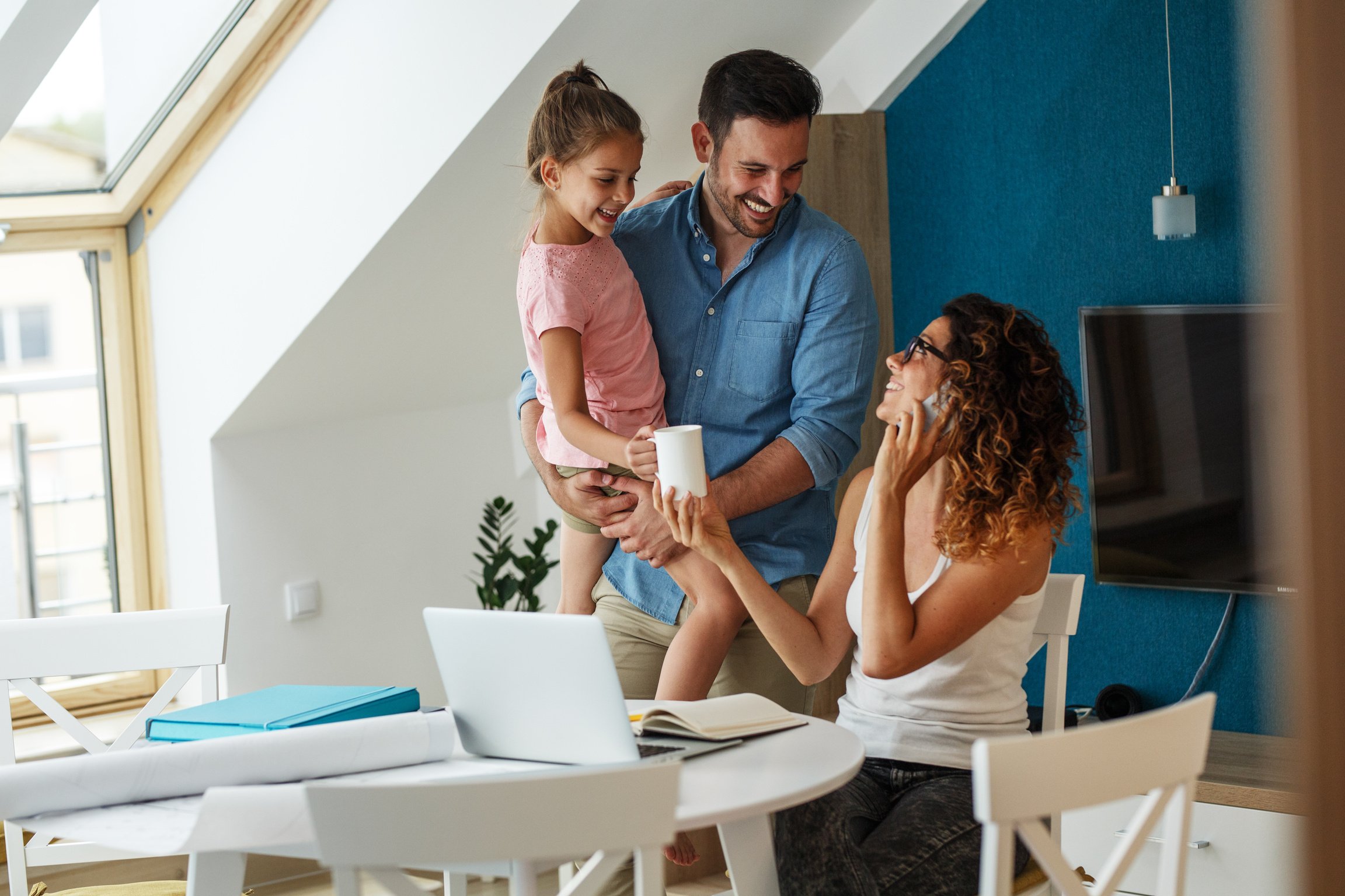 Happy family in living room.